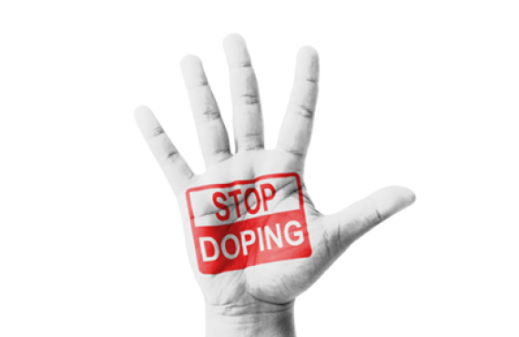 Open hand raised with Stop Doping sign painted